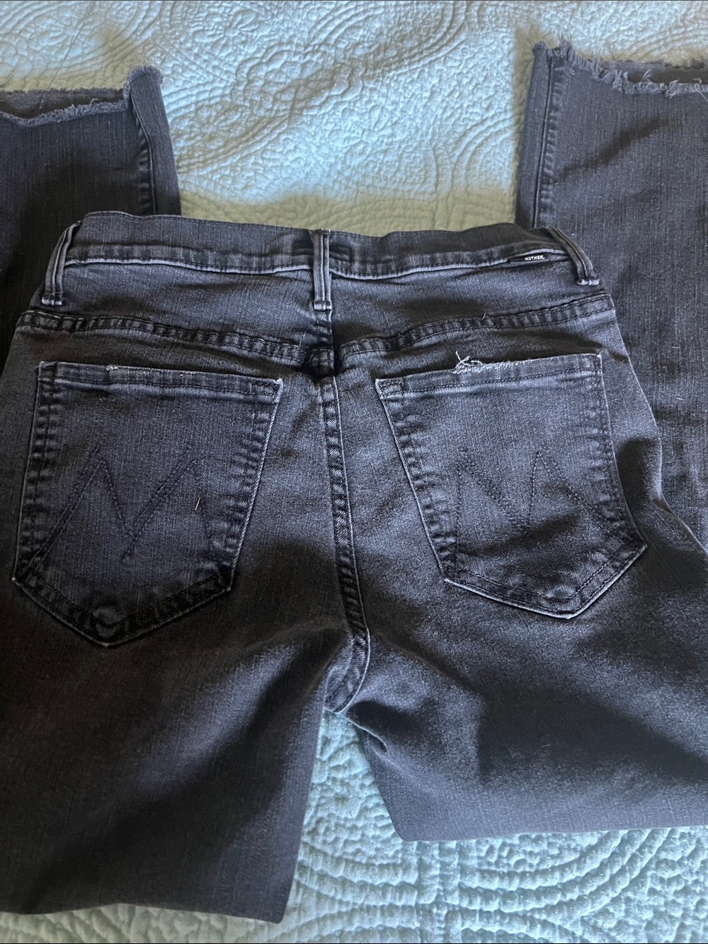 MOTHER Black Washed Denim Jeans with Subtle Fray Detail